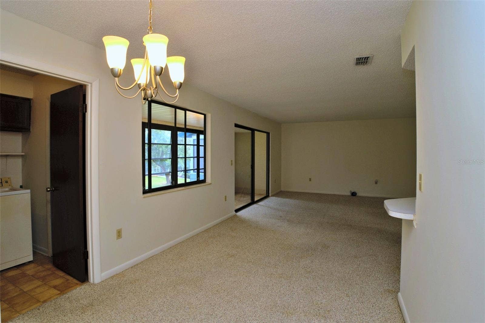 516 SILVER COURSE, #B, Ocala, FL 34472 Dining Room & Family Room, Laundry Room off to the Left