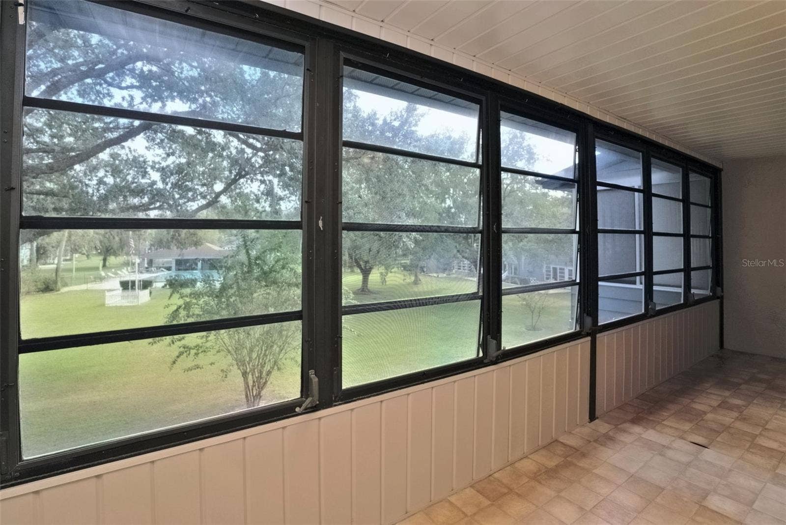 516 SILVER COURSE, #B, Ocala, FL 34472 Lanai is screened in with roll open or closed windows