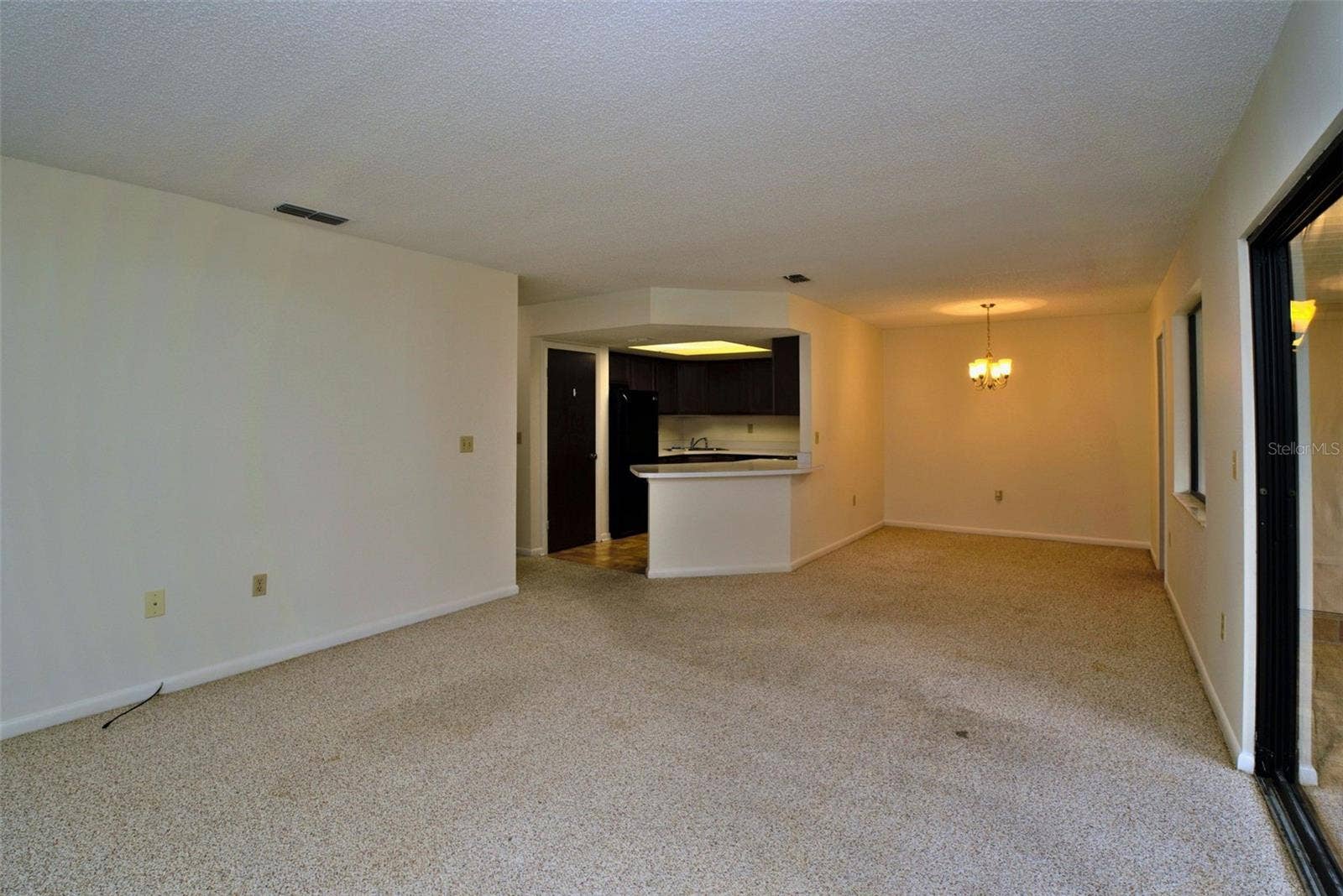 516 SILVER COURSE, #B, Ocala, FL 34472 Family Room Looking into the Kitchen and Dining Room