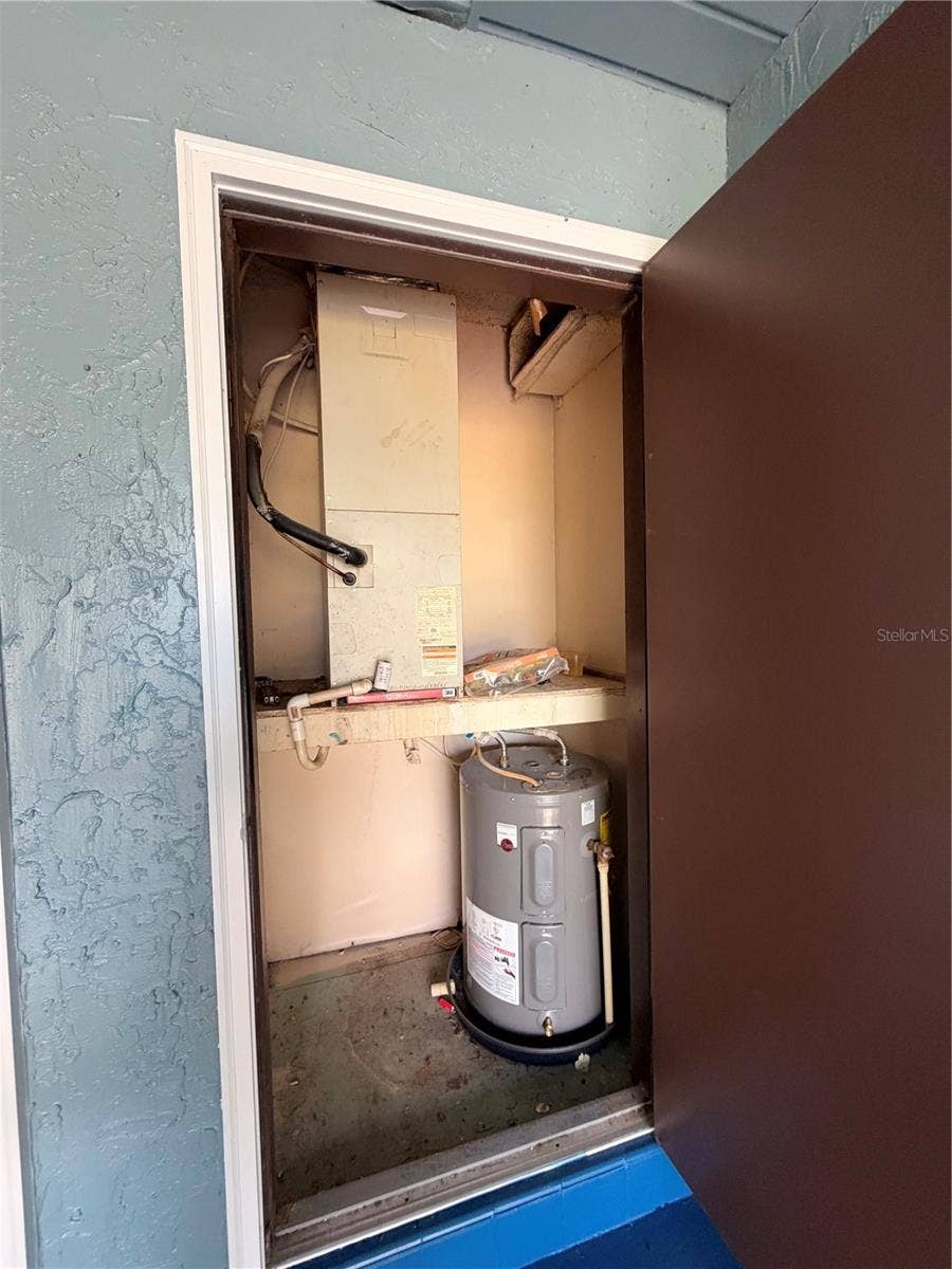 516 SILVER COURSE, #B, Ocala, FL 34472 Utility Room, Hot Water Tank, AC Unit