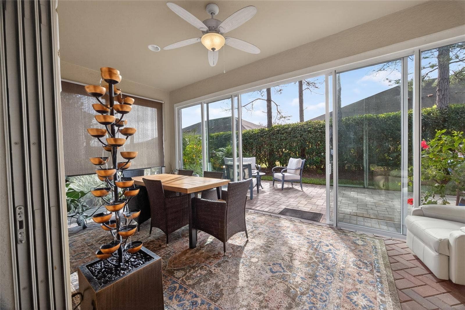 9106 SW 65TH LOOP, Ocala, FL 34481 Sunroom doors open on 2 sides to enjoy the beautiful weather all year round. Private back patio.