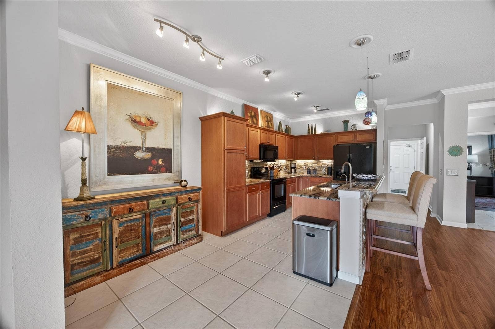 9106 SW 65TH LOOP, Ocala, FL 34481 Kitchen with lots of storage, bright lights and space for socializing and enjoying meals.