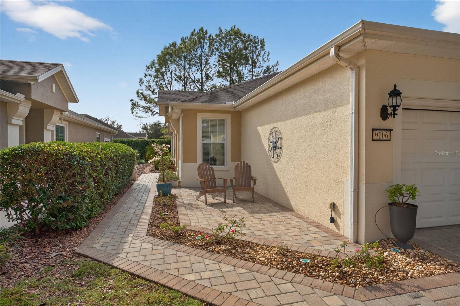 9106 SW 65TH LOOP, Ocala, FL 34481 Side entrance with privacey greenery.