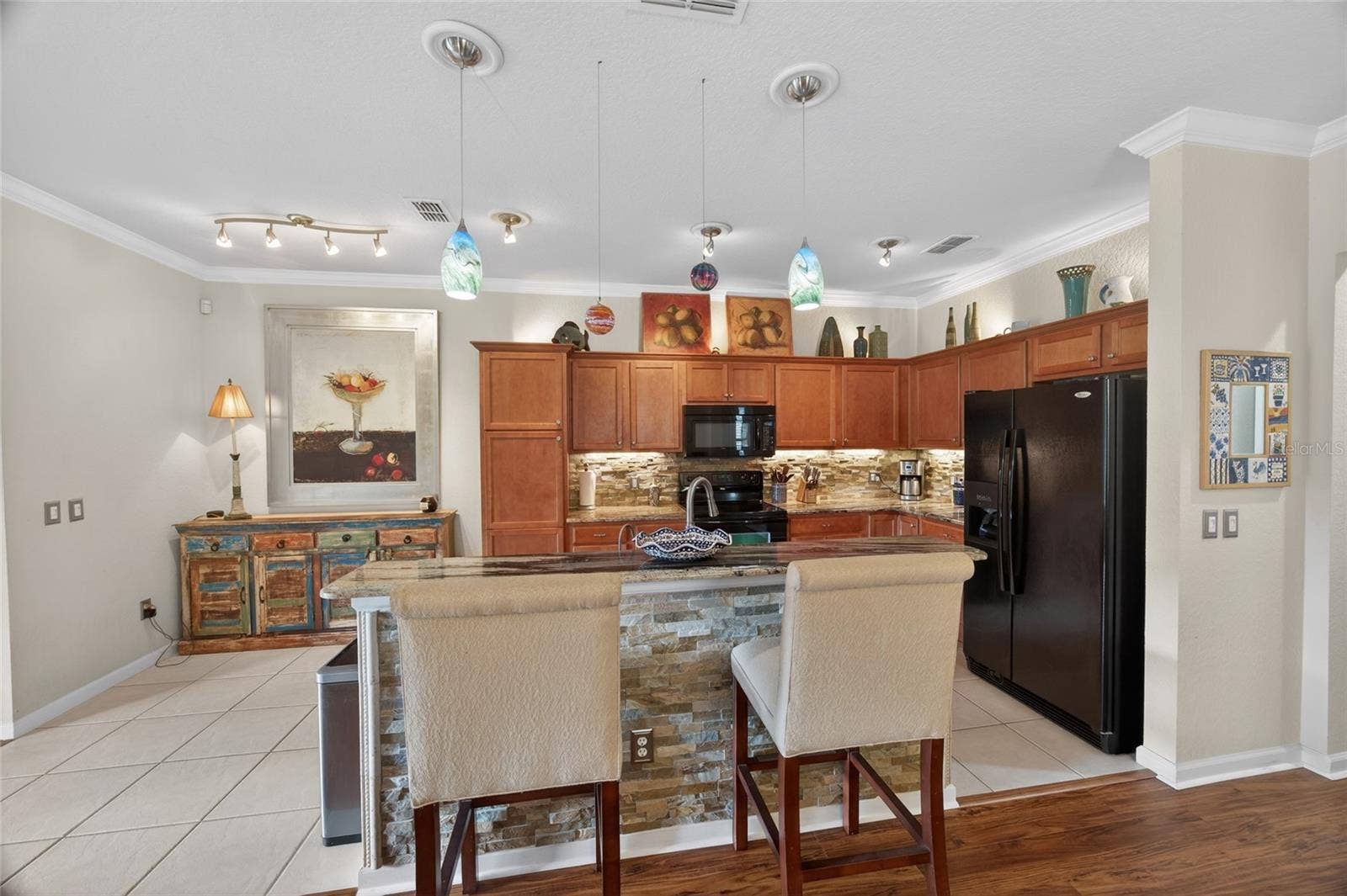 9106 SW 65TH LOOP, Ocala, FL 34481 View into kitchen from the living room.