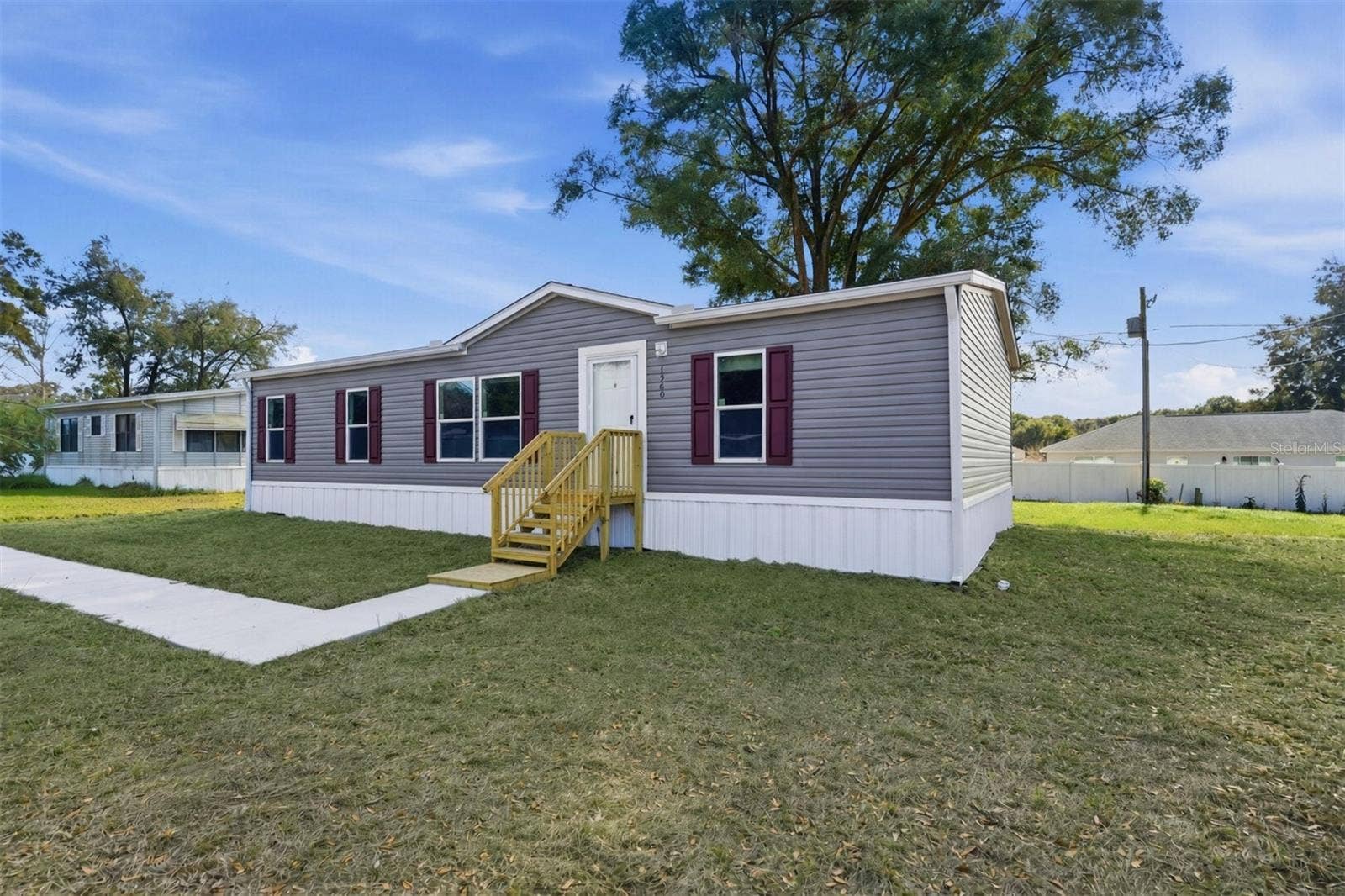 1560 NE 162ND STREET, Citra, FL 32113 Front view with walk way