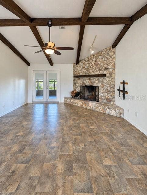 3645 SE 48 STREET, Ocala, FL 34480 Spacious family room with fireplace and french doors