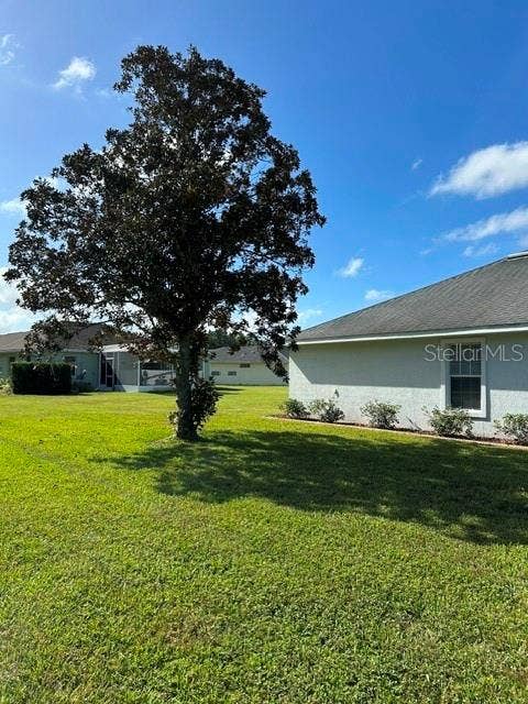 7198 SW 113TH LOOP, Ocala, FL 34476 Magnolia Tree at side of Home