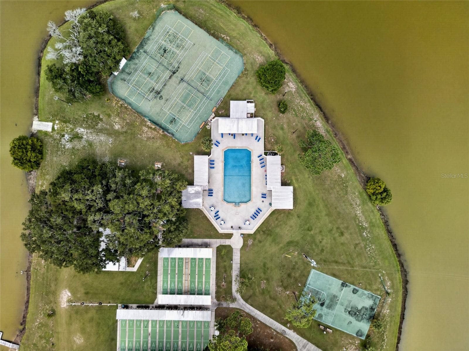 4409 CLUB CIRCLE, Lake Wales, FL 33898 The Island houses the community pool, shuffle board courts, tennis/pickle ball courts, basketball, horseshoe pits, and occasional cookouts.