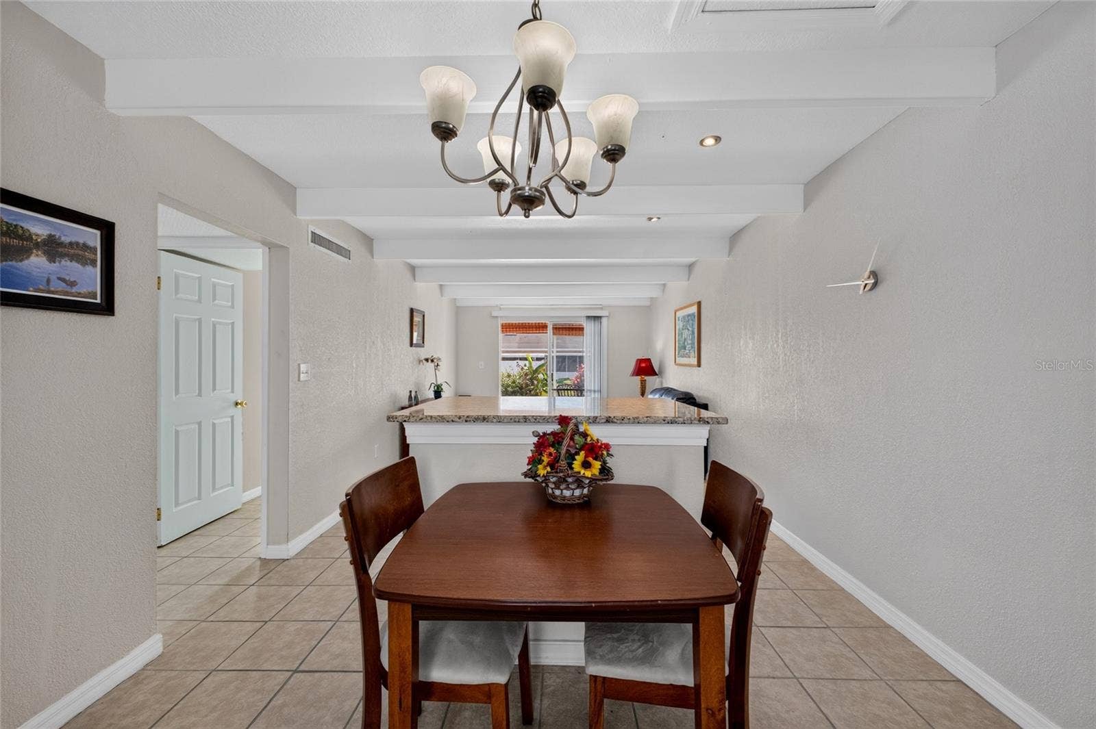 4409 CLUB CIRCLE, Lake Wales, FL 33898 Open floor plan in the living room and dining area.