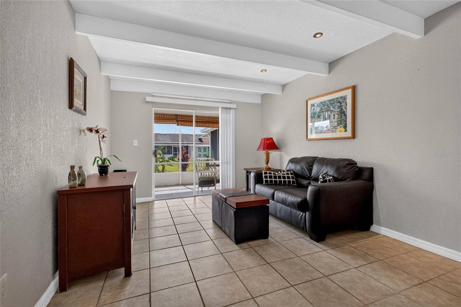4409 CLUB CIRCLE, Lake Wales, FL 33898 The living room is 11' x 14' with a sliding glass door that opens to the back screened porch.