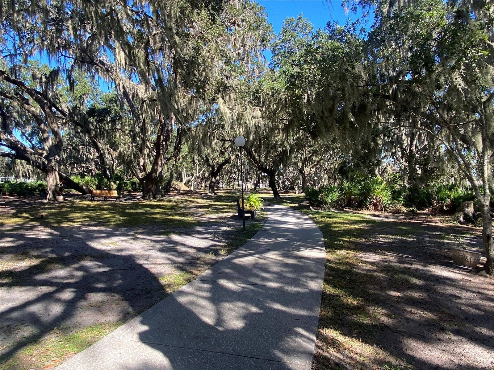 4409 CLUB CIRCLE, Lake Wales, FL 33898 Concrete pathways make an easy walk to enjoy nature.