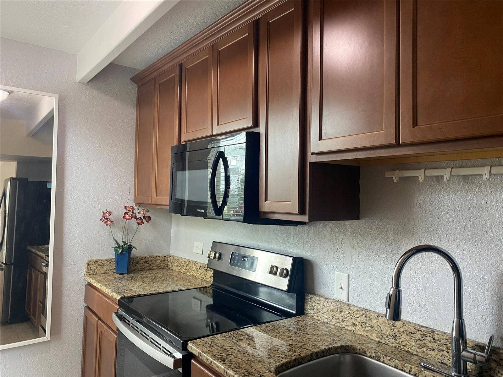 4409 CLUB CIRCLE, Lake Wales, FL 33898 The galley kitchen has beautiful wood cabinetry.