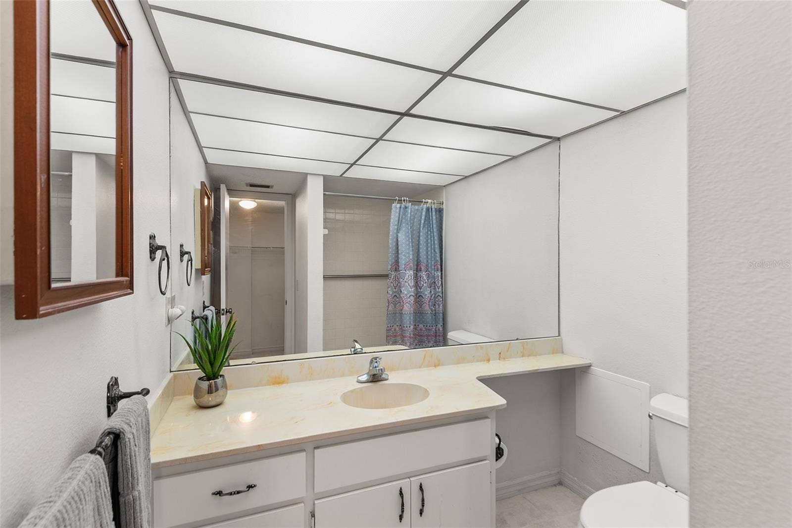 1776 6TH STREET NW, #304, Winter Haven, FL 33881 PRIMARY BATHROOM. REFLECTION OF SHOWER IN MIRROR!