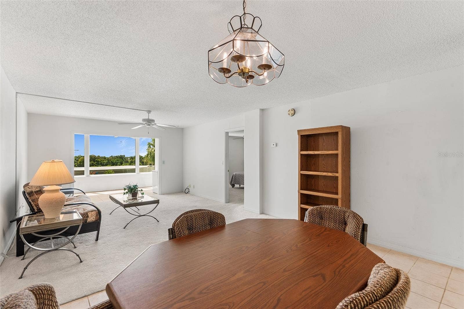 1776 6TH STREET NW, #304, Winter Haven, FL 33881 DINING AND LIVING ROOM AREA. BONUS ROOM BEYOND