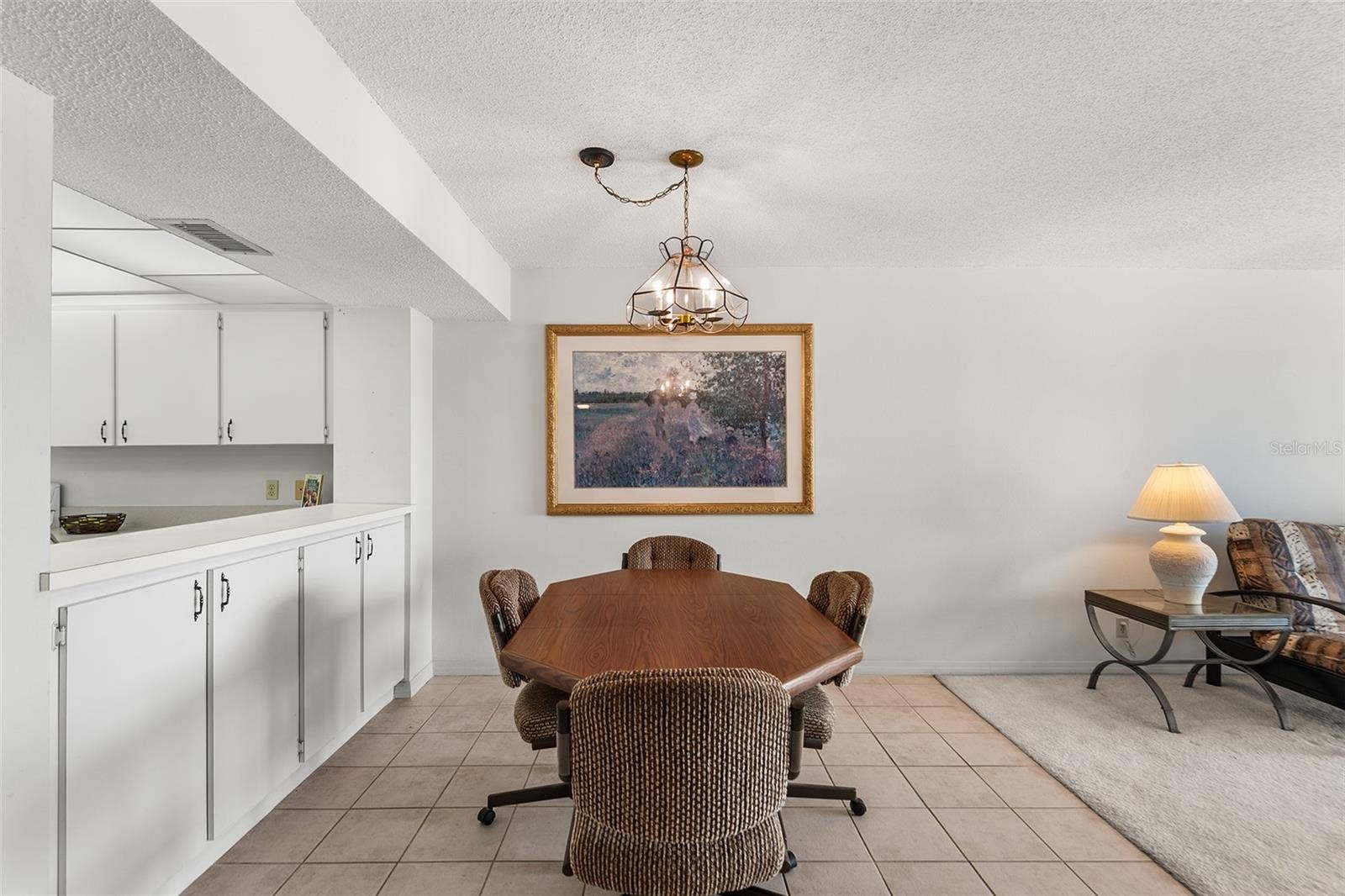 1776 6TH STREET NW, #304, Winter Haven, FL 33881 DINING AREA. PASS TRU FROM KITCHEN TO LEFT.
