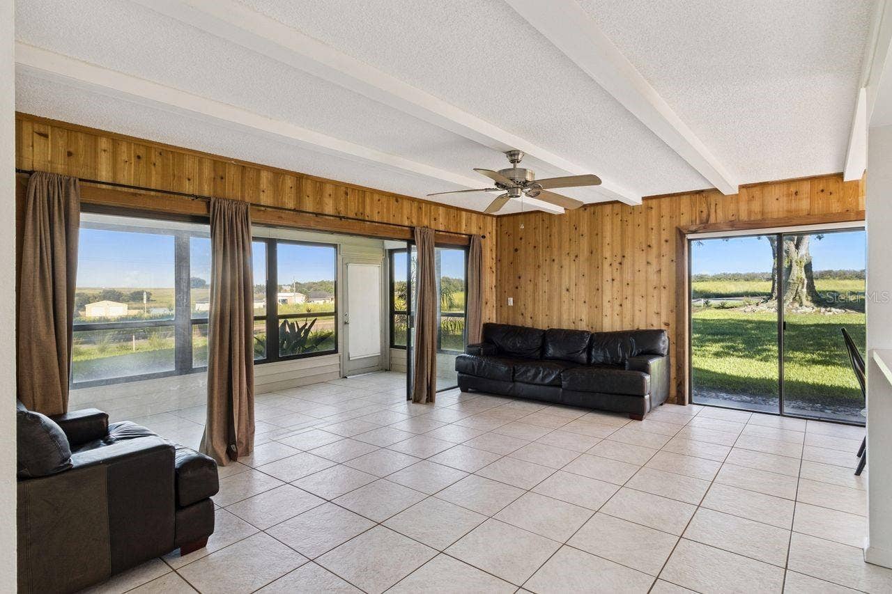109 LA CASA, #109, Lake Wales, FL 33898 Spacious living room that opens onto Florida room