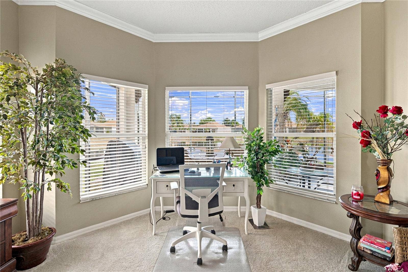 4232 DORNOCH DRIVE, Lake Wales, FL 33859 The bay window area in the primary bedroom offers a great view of the pond behind.