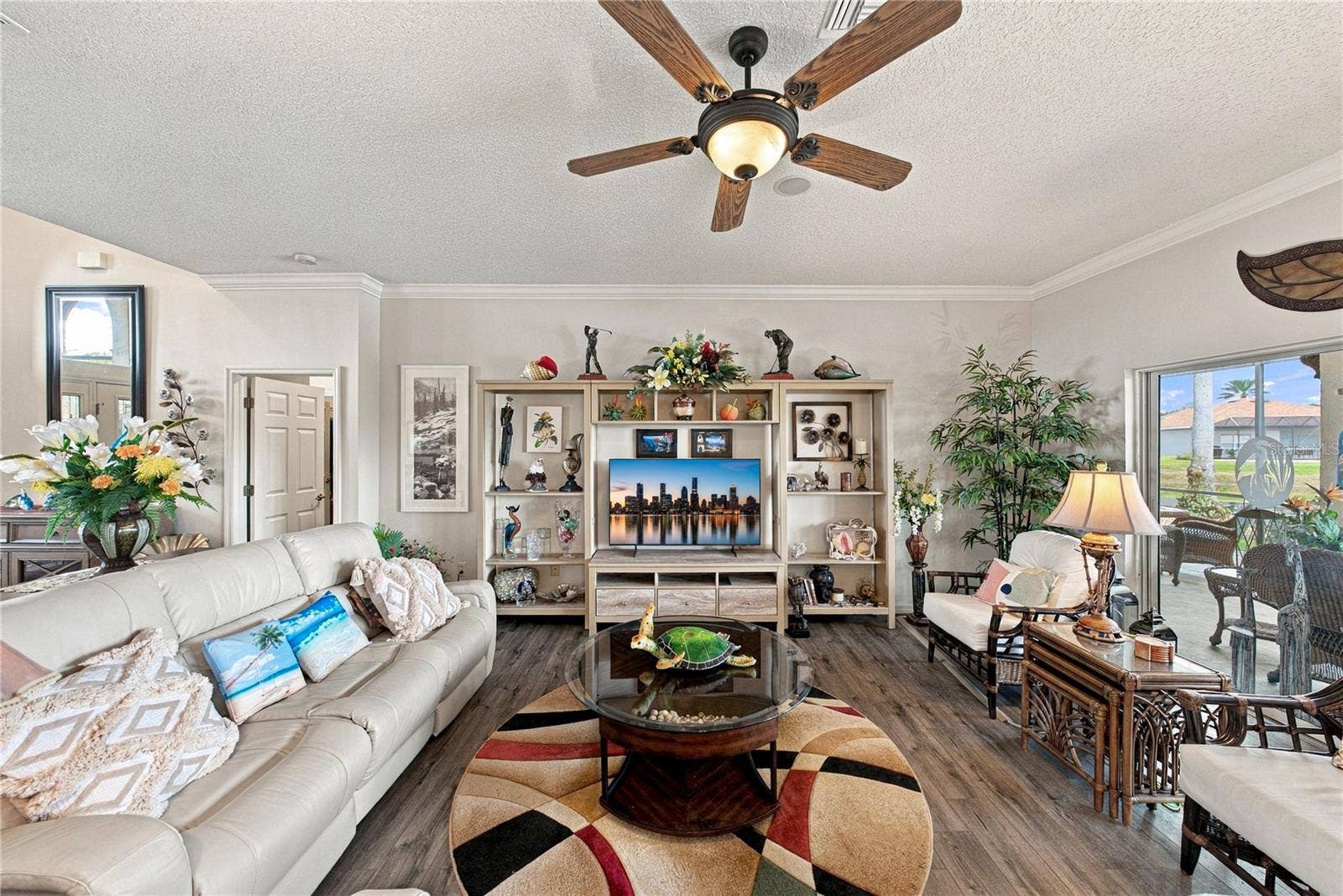 4232 DORNOCH DRIVE, Lake Wales, FL 33859 The living room has a designer ceiling fan with light.