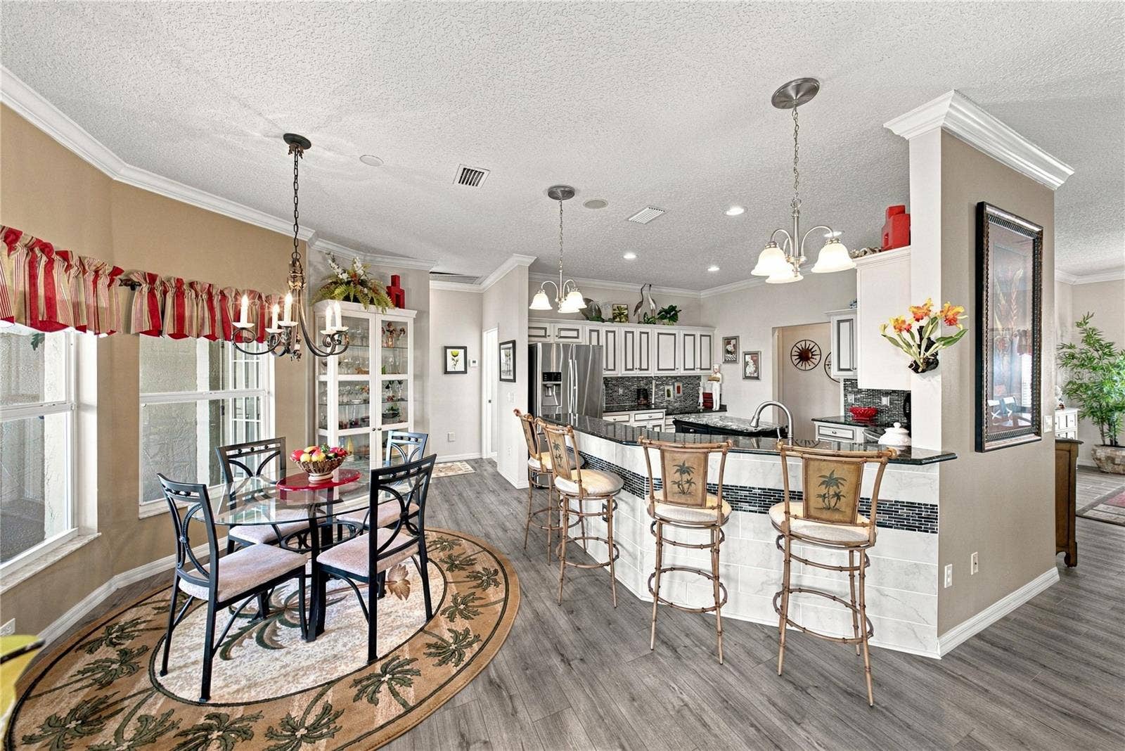 4232 DORNOCH DRIVE, Lake Wales, FL 33859 The kitchen features an elevated snack bar. The tile with accent on the snack bar wall adds beauty.