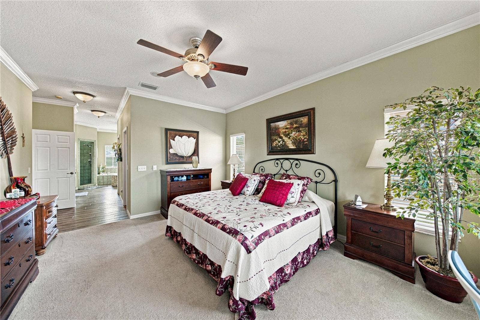 4232 DORNOCH DRIVE, Lake Wales, FL 33859 The hallway connecting the primary bedroom the primary bathroom holds the 2 large walk-in closets and the linen closet.