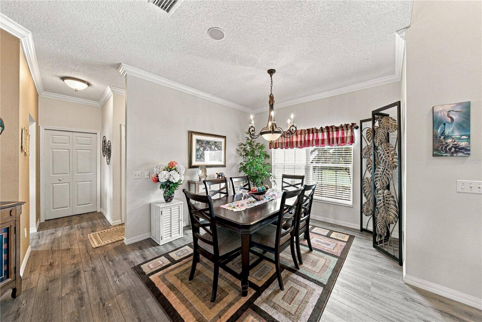 4232 DORNOCH DRIVE, Lake Wales, FL 33859 The flexibility of the dining room makes entertaining easy! The large closet pantry is in the background on the left.