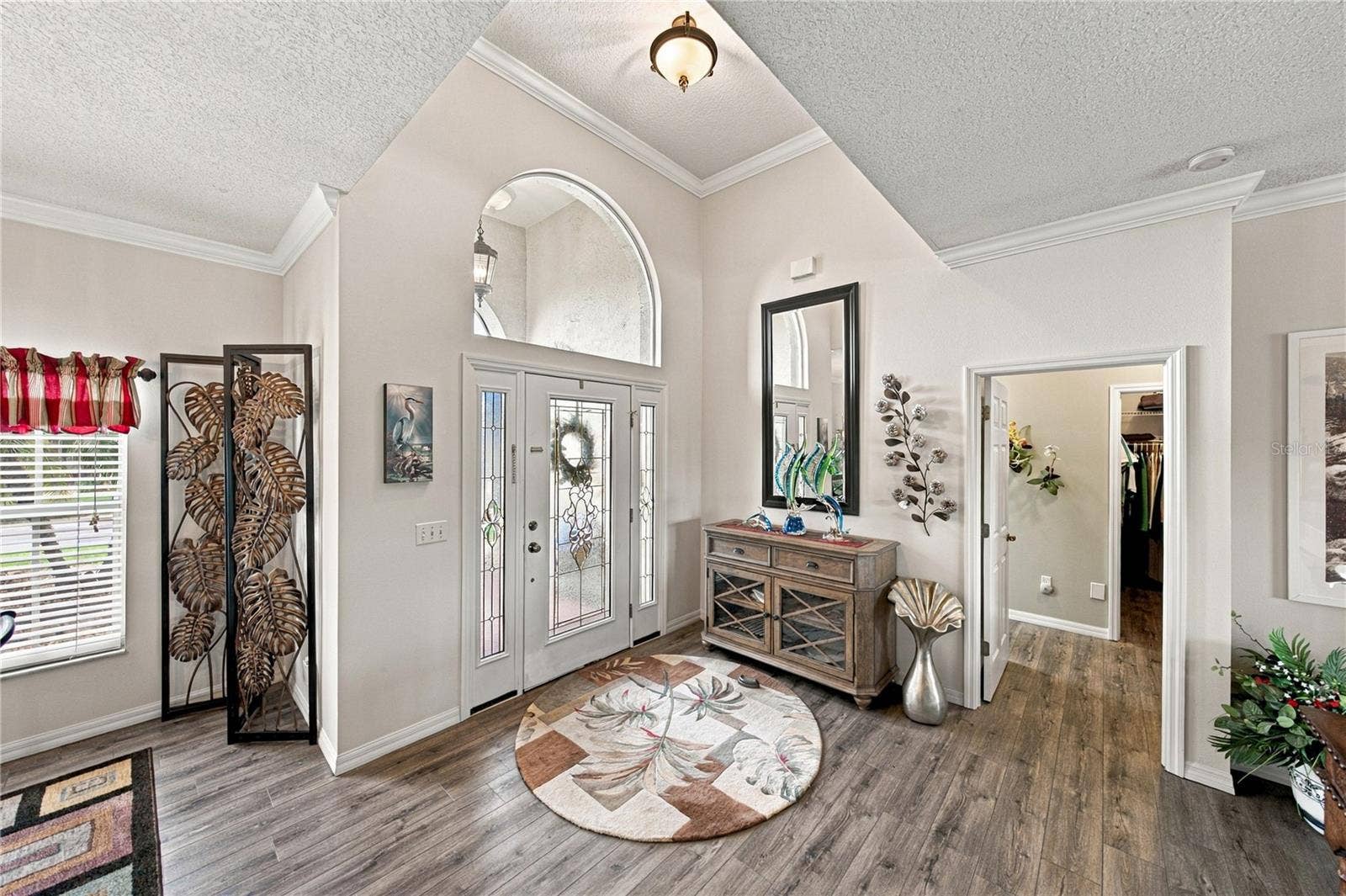 4232 DORNOCH DRIVE, Lake Wales, FL 33859 This split floor plan home has the primary suite filling the entire west wing of this home. The doorway is visible on the right.