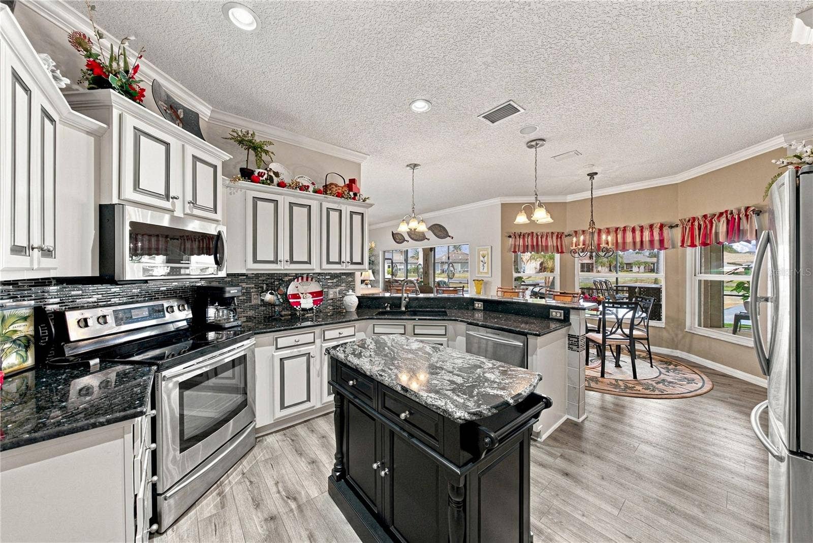 4232 DORNOCH DRIVE, Lake Wales, FL 33859 The ample cabinetry with crown molding on top provides desirable storage options.