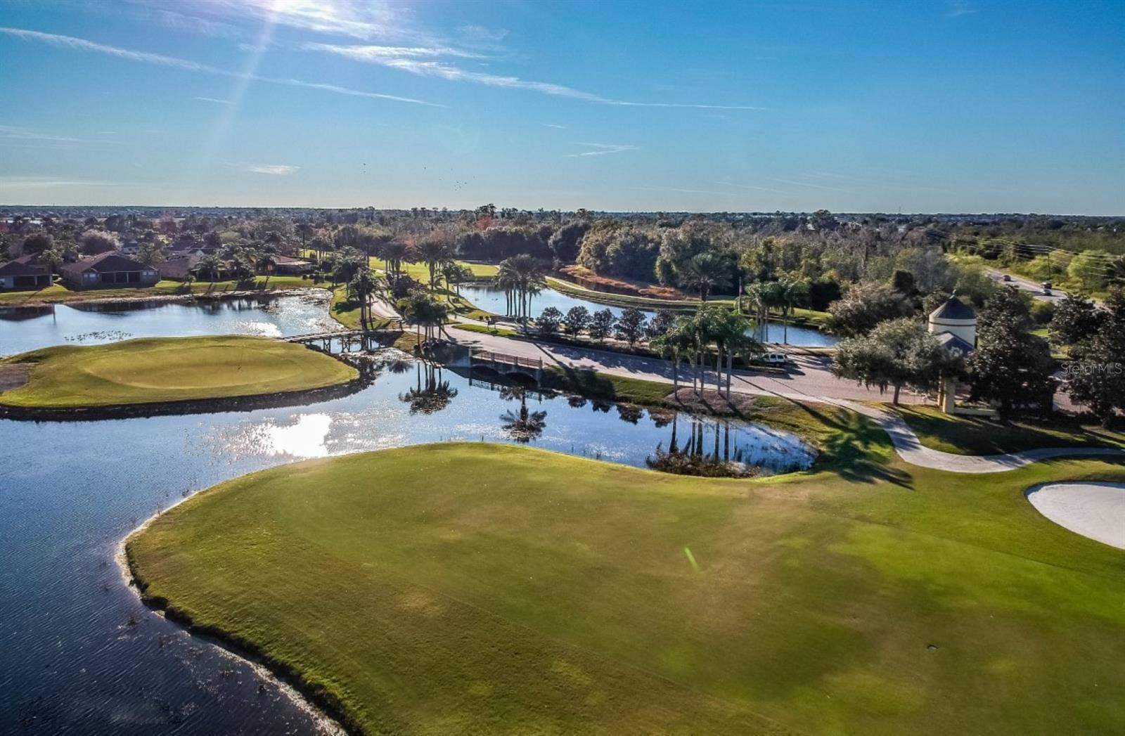 4232 DORNOCH DRIVE, Lake Wales, FL 33859 Lake Ashton has 2 par 70 private courses that residents can join. A variety of membership options exist. This is a view of the East Course's signature par 4 island green hole.