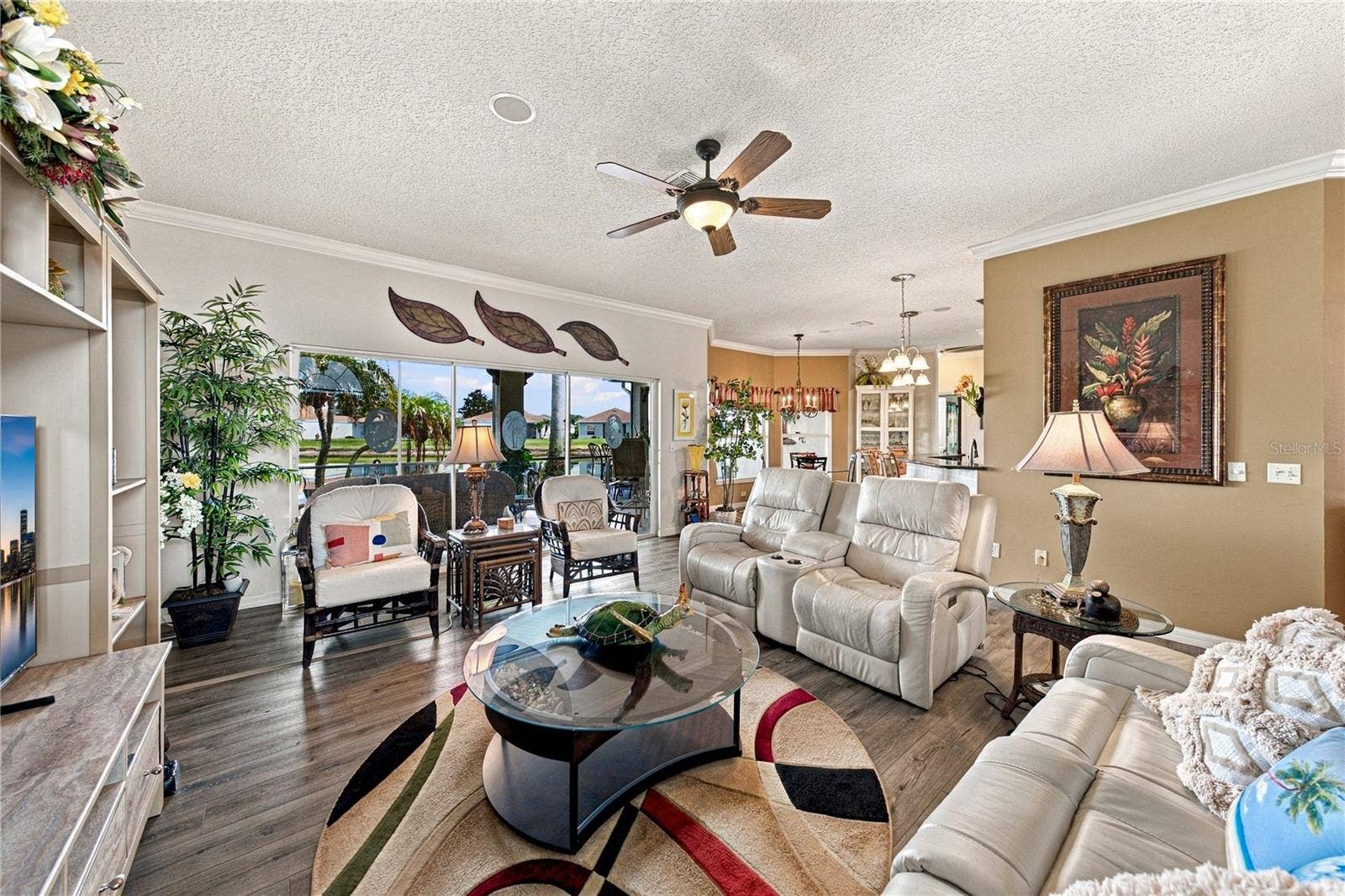 4232 DORNOCH DRIVE, Lake Wales, FL 33859 The triple slider at the north end of the living room opens to the expanded covered and "bird caged" lanai.