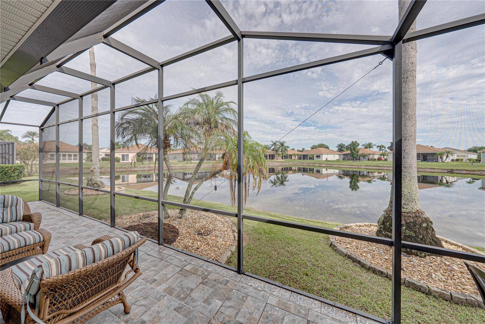 4232 DORNOCH DRIVE, Lake Wales, FL 33859 The palms, landscaping, and pond view set this home appart.