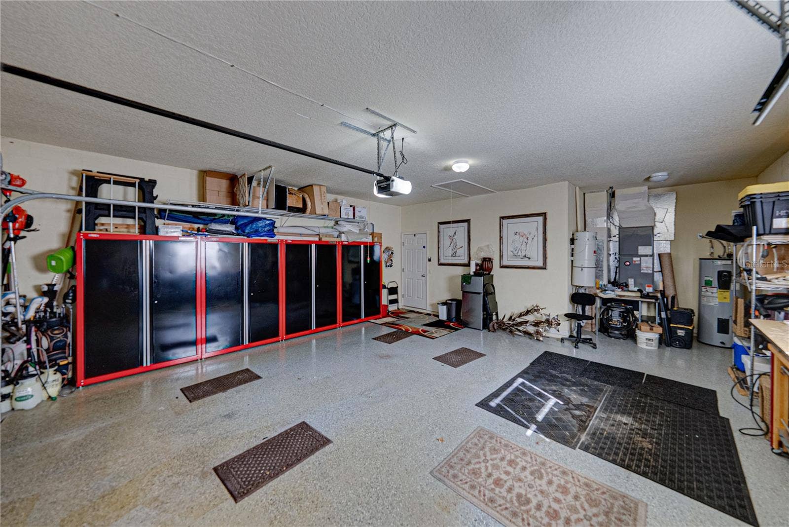 4232 DORNOCH DRIVE, Lake Wales, FL 33859 The alcove at the north end of the garage holds the whole house vacuum system.