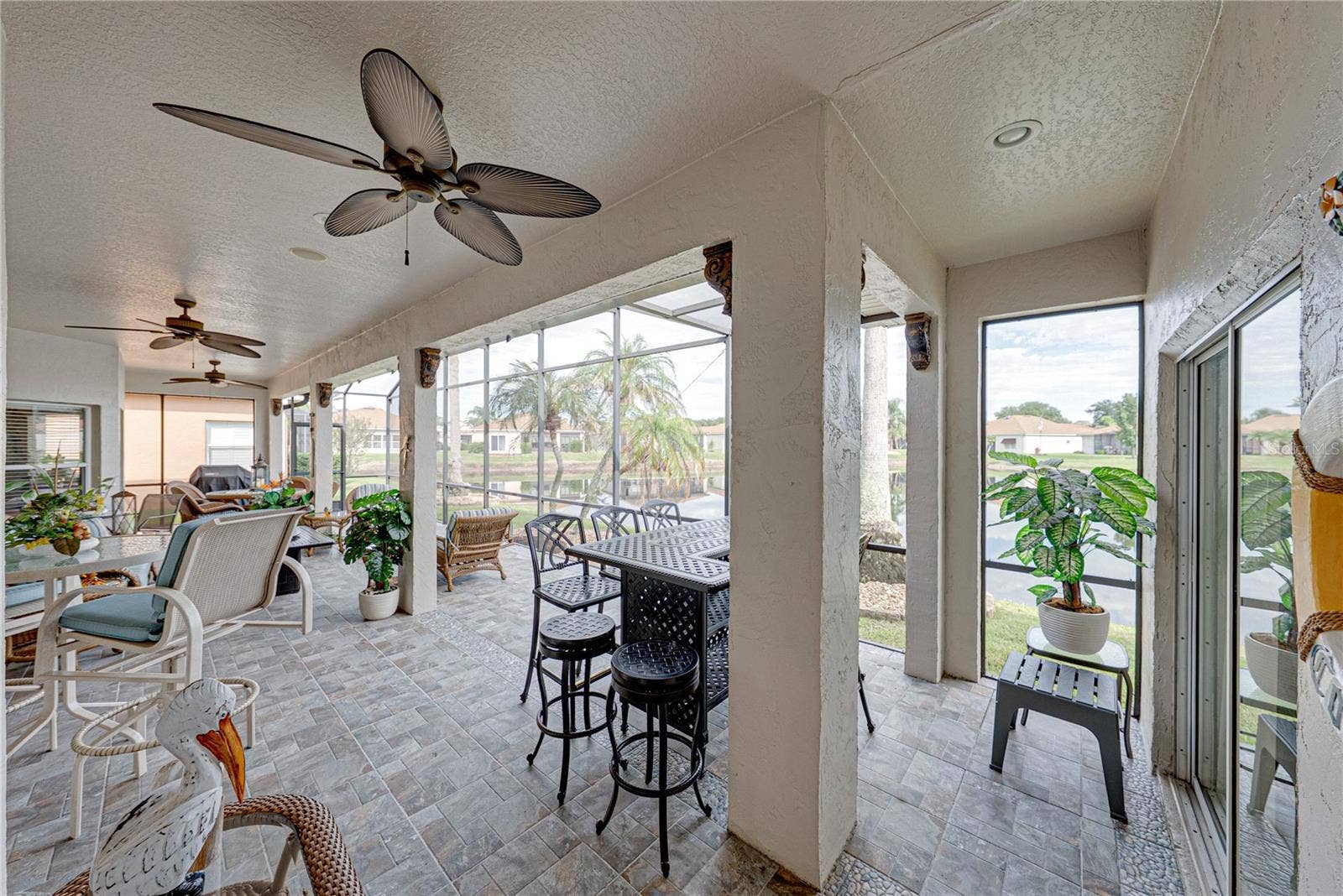 4232 DORNOCH DRIVE, Lake Wales, FL 33859 The expanded covered and bird caged lanai has ceramic tile flooring and 2 ceiling fans.