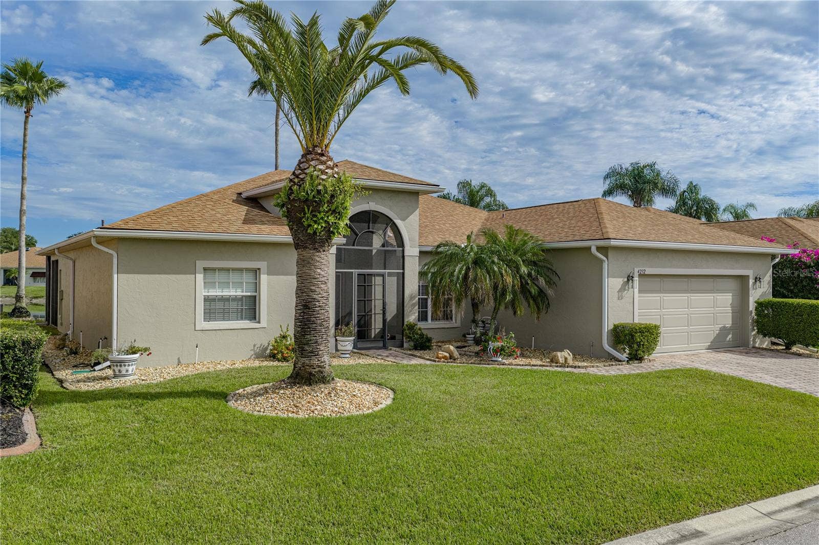 4232 DORNOCH DRIVE, Lake Wales, FL 33859 The quality landscaping encircles this home and includes stately palms and other plantings.
