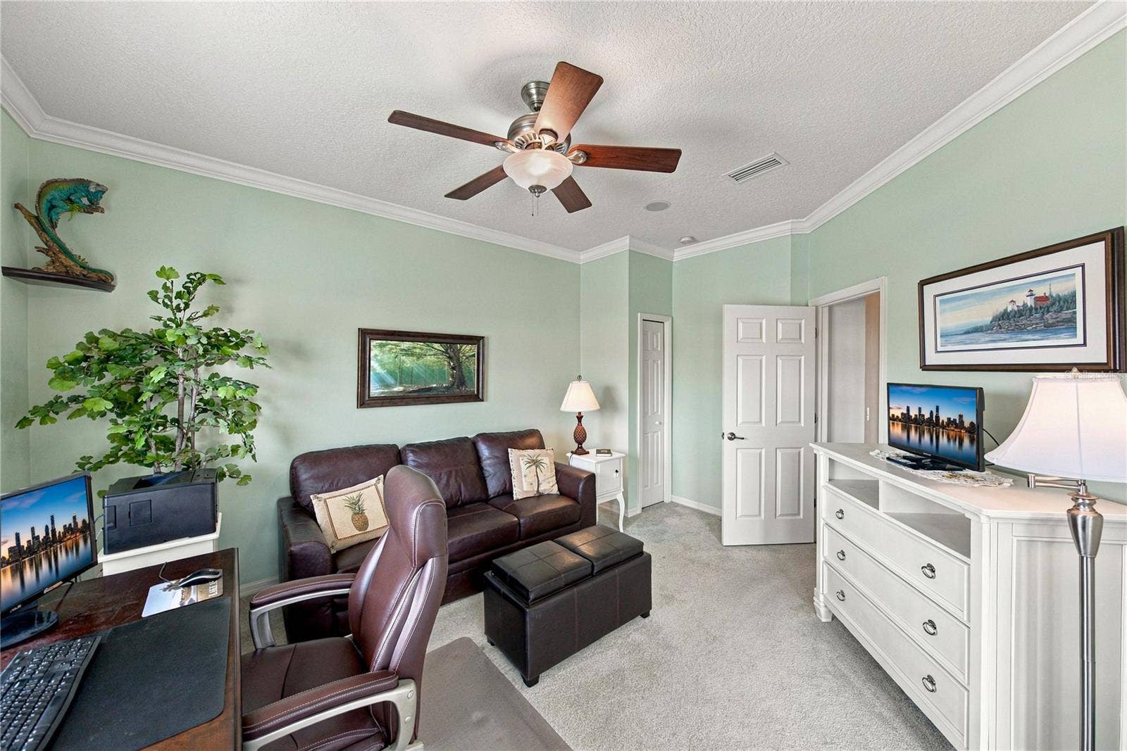 4232 DORNOCH DRIVE, Lake Wales, FL 33859 The third bedroom has a closet, crown molding, a custom ceiling fan with light, and is adjacent to the guest bath.