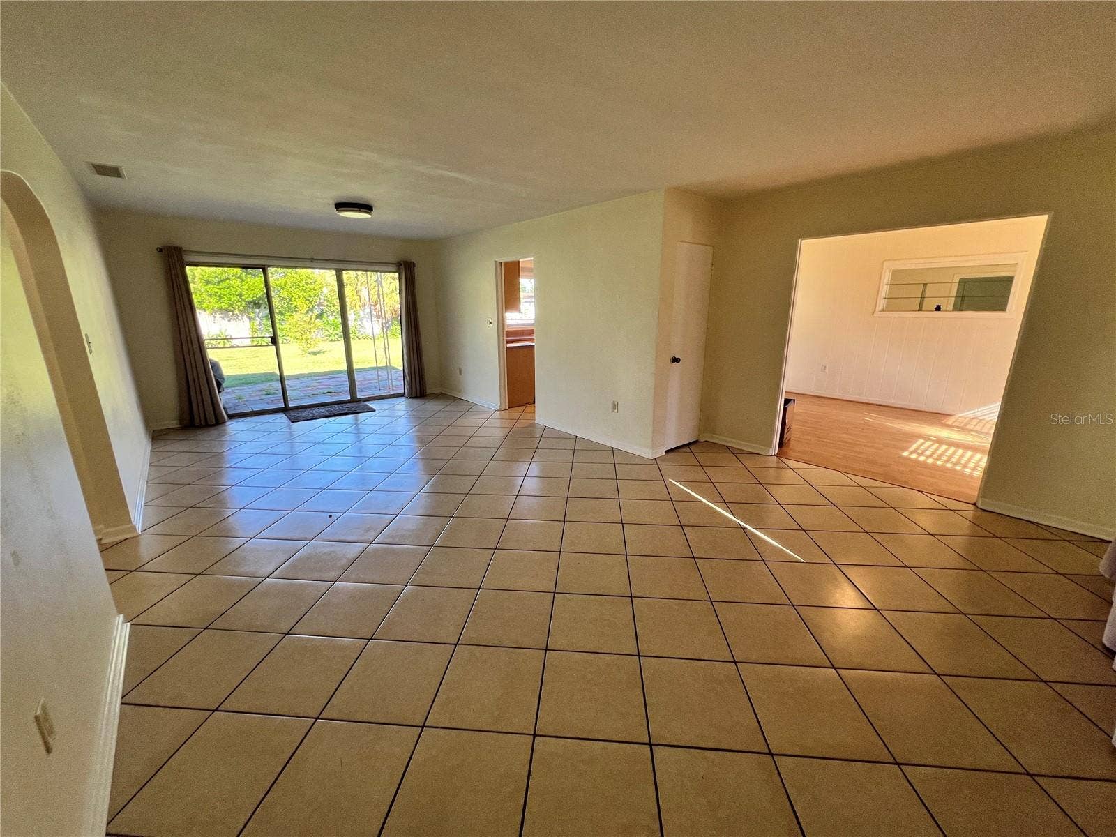 1881 15TH STREET NW, Winter Haven, FL 33881 Dining/Living room combo with sliding glass door to back yard