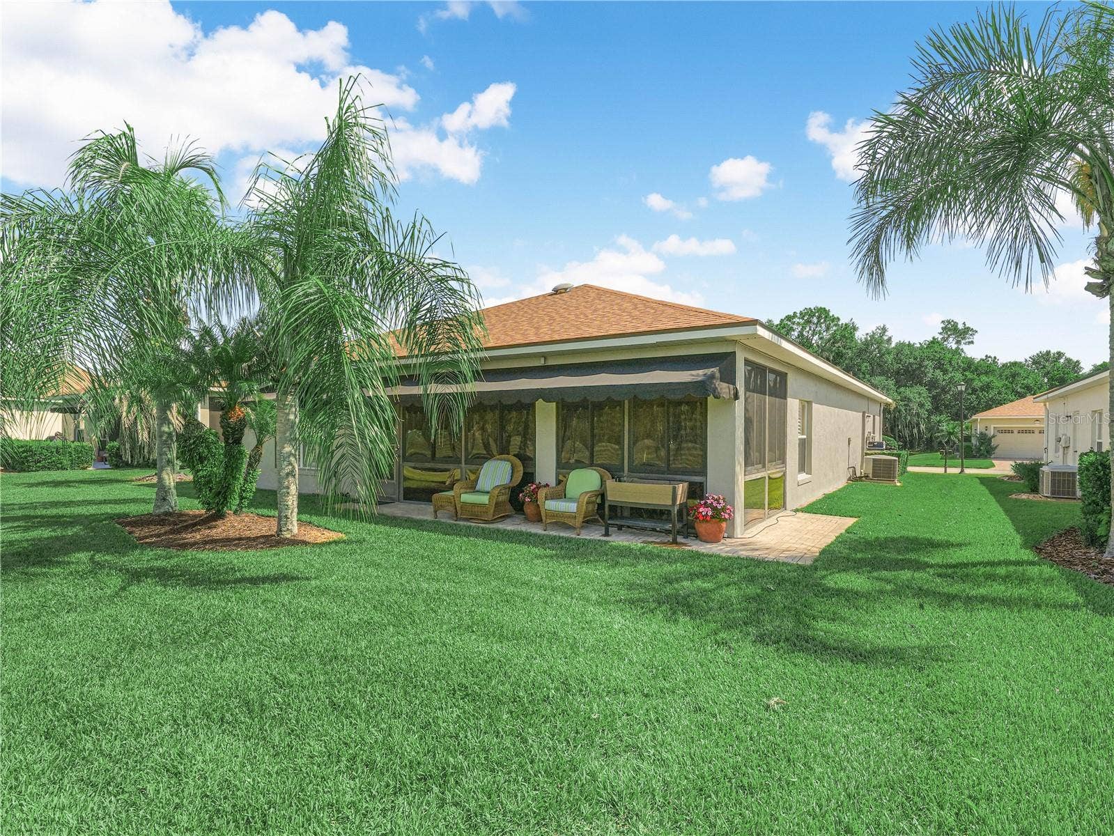 Outdoor Paver Area, Awning on Windows