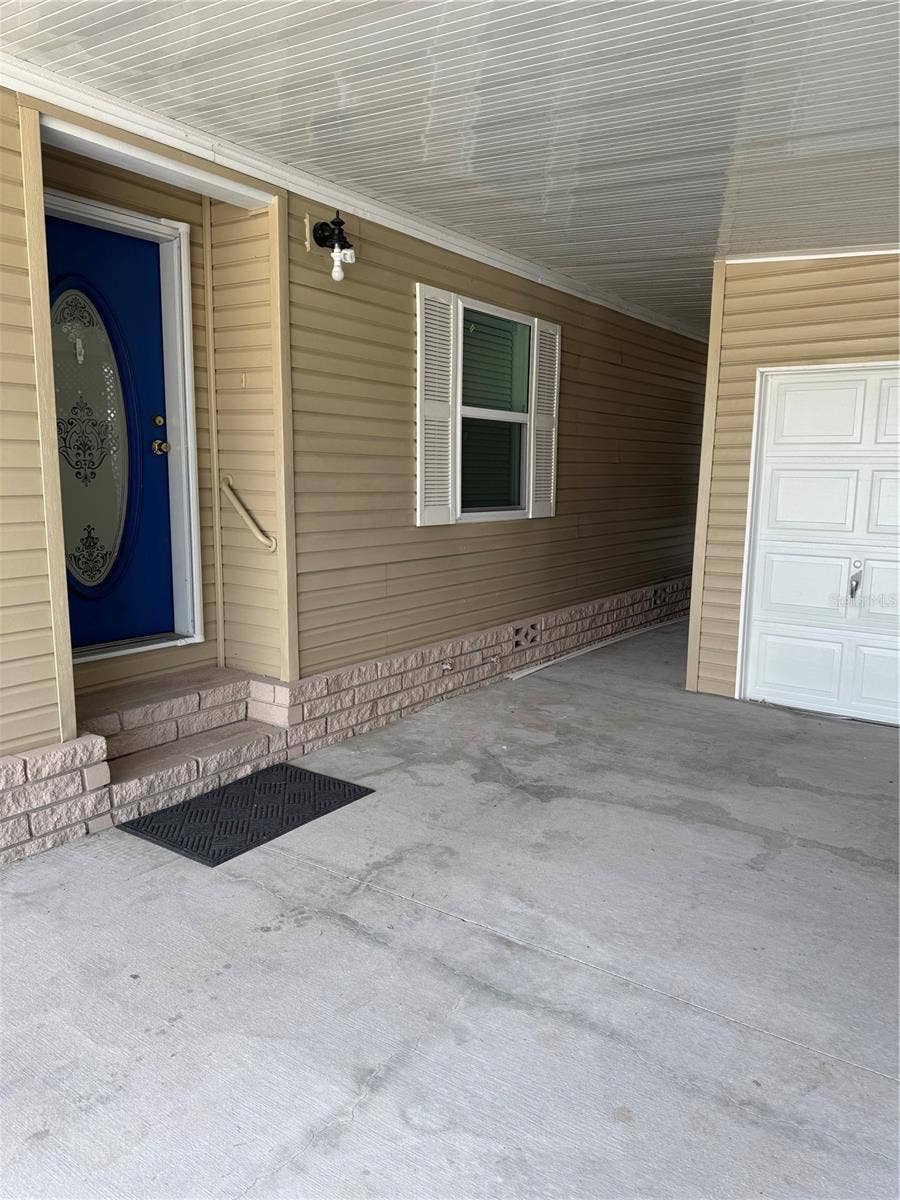 57 STRAPHMORE DRIVE, Haines City, FL 33844 Entry and golf cart garage