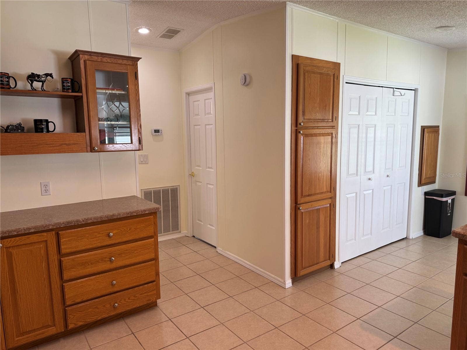 57 STRAPHMORE DRIVE, Haines City, FL 33844 Kitchen with hall to guest bath and bed