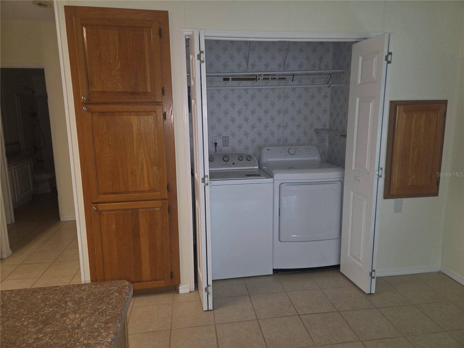 57 STRAPHMORE DRIVE, Haines City, FL 33844 Kitchen dinnett area has washer and dryer tucked in here
