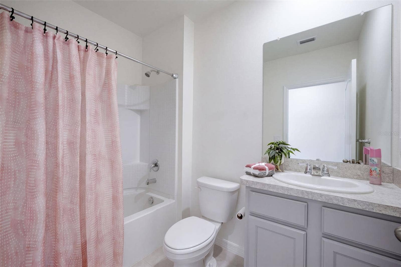 2415 BRASSIE COURT, Winter Haven, FL 33884 Guest Bathroom features a comfort height vanity with tub/shower unit