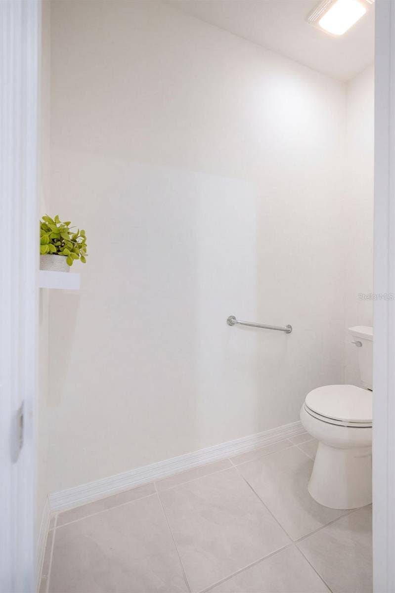 2415 BRASSIE COURT, Winter Haven, FL 33884 A private water closet includes a comfort-height toilet with a safety grab bar