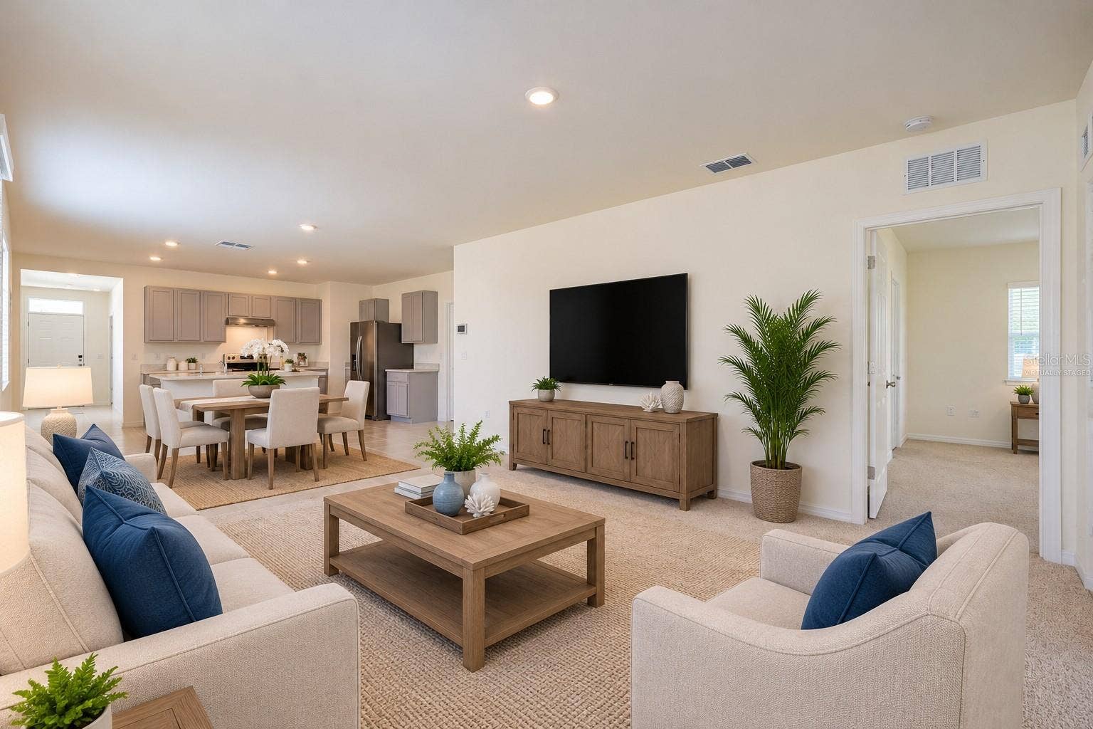 2415 BRASSIE COURT, Winter Haven, FL 33884 Virtually Staged, The spacious living room offers high ceilings and a glass sliding door leading to the Florida room