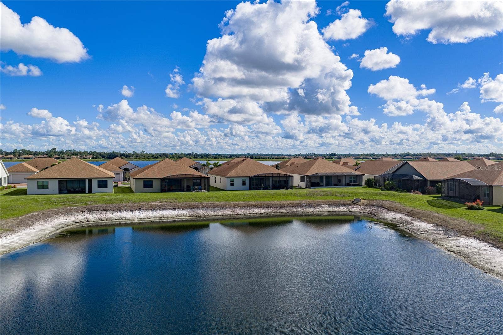 6125 PEBBLE BEACH BOULEVARD, Winter Haven, FL 33884 Pond behind house