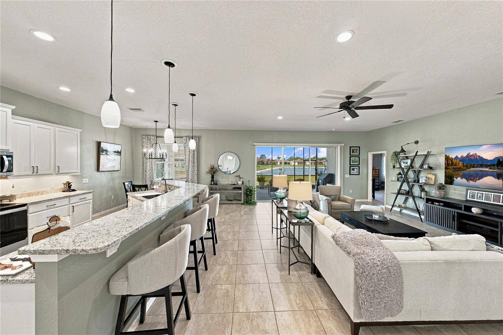 6125 PEBBLE BEACH BOULEVARD, Winter Haven, FL 33884 Kitchen bar & Living room