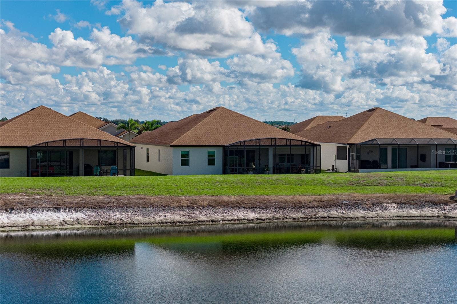 6125 PEBBLE BEACH BOULEVARD, Winter Haven, FL 33884 House drone view from pond