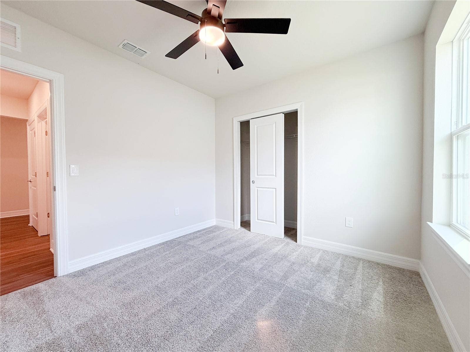 1079 MICHELANGELO LANE, Winter Haven, FL 33884 Second bedroom is situated away from the other bedrooms, offering privacy