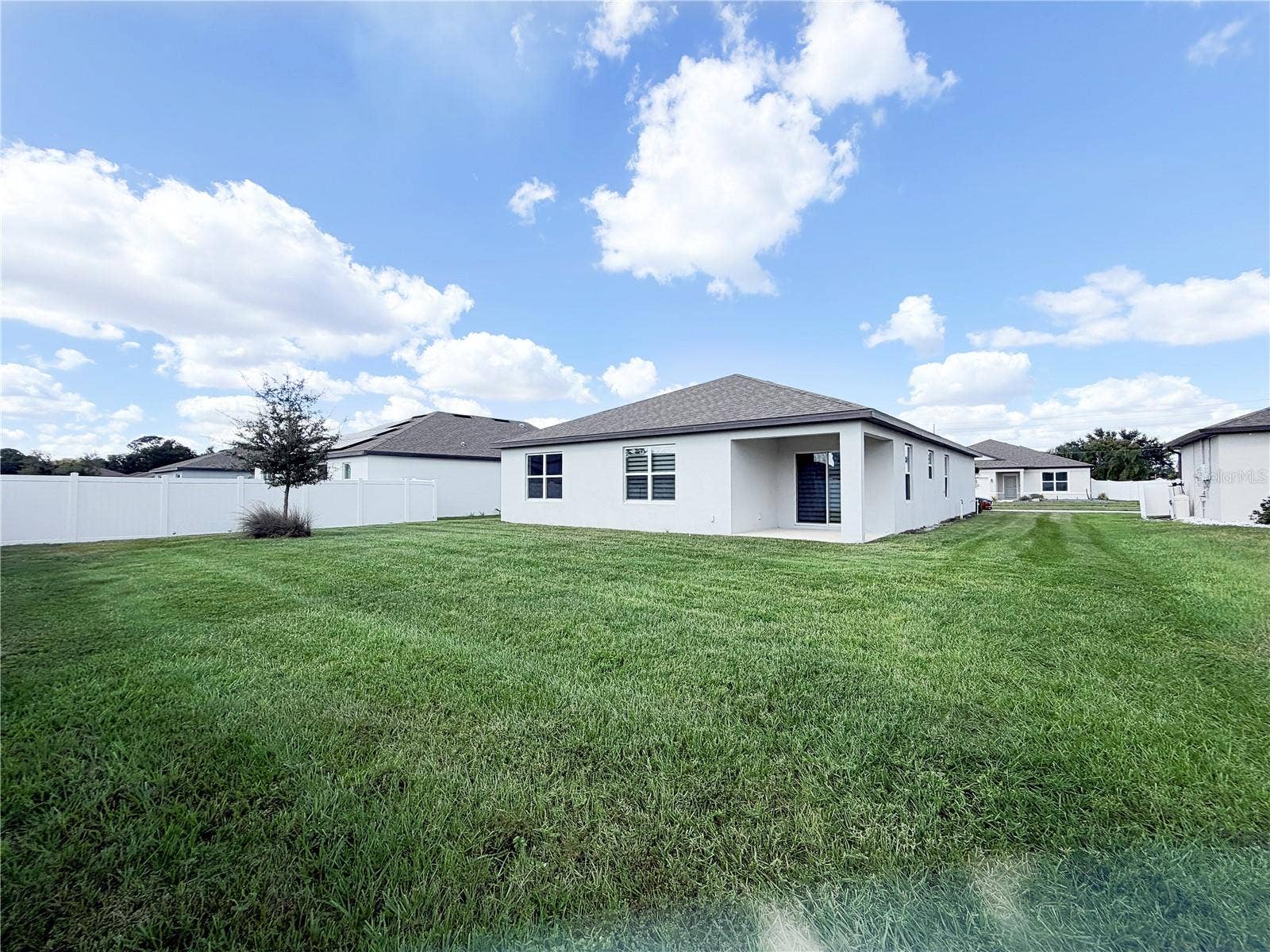 1079 MICHELANGELO LANE, Winter Haven, FL 33884 Backyard offers lots of space