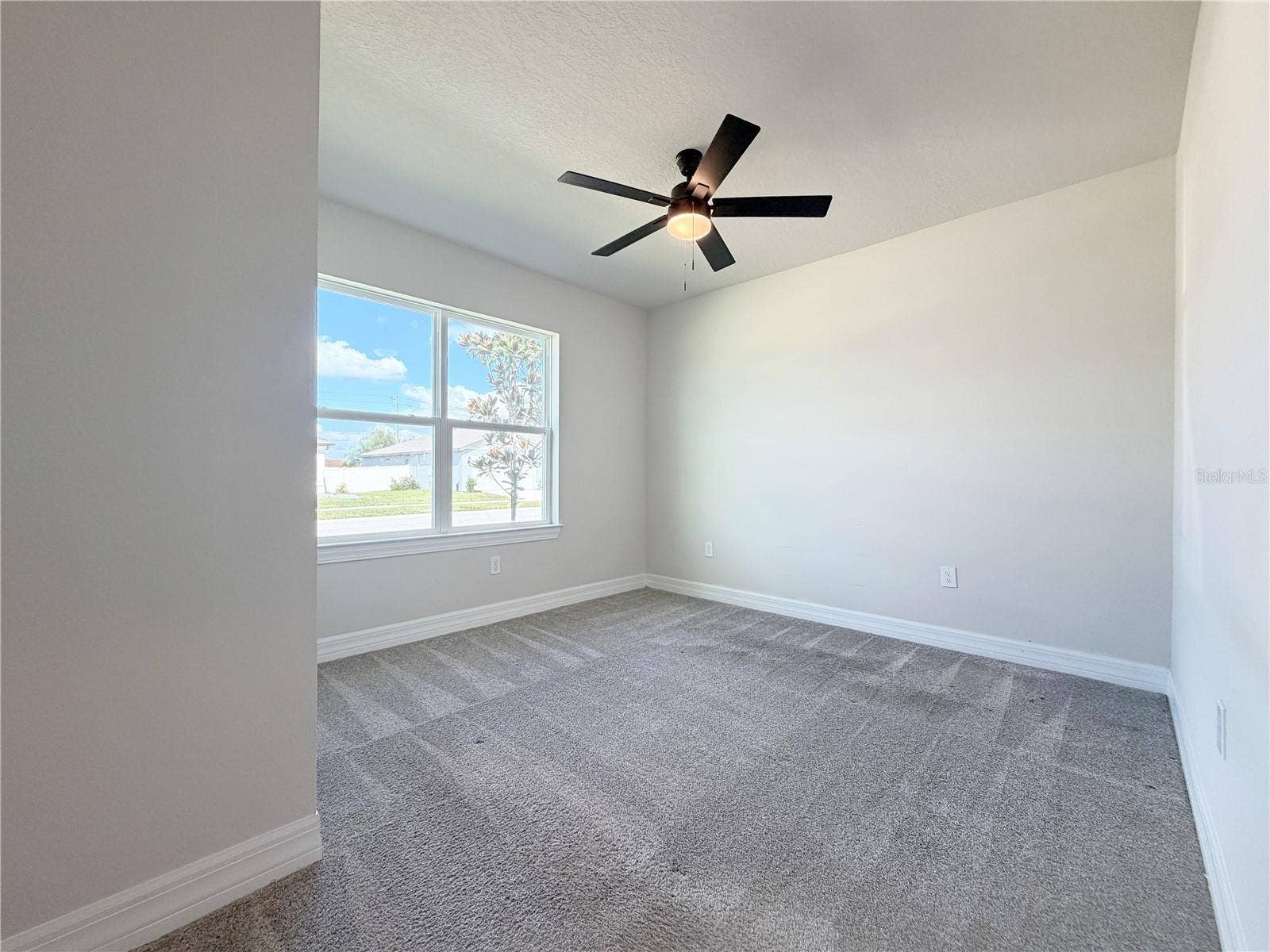 1079 MICHELANGELO LANE, Winter Haven, FL 33884 Fourth bedroom at the front of the home offers wonderful natural light
