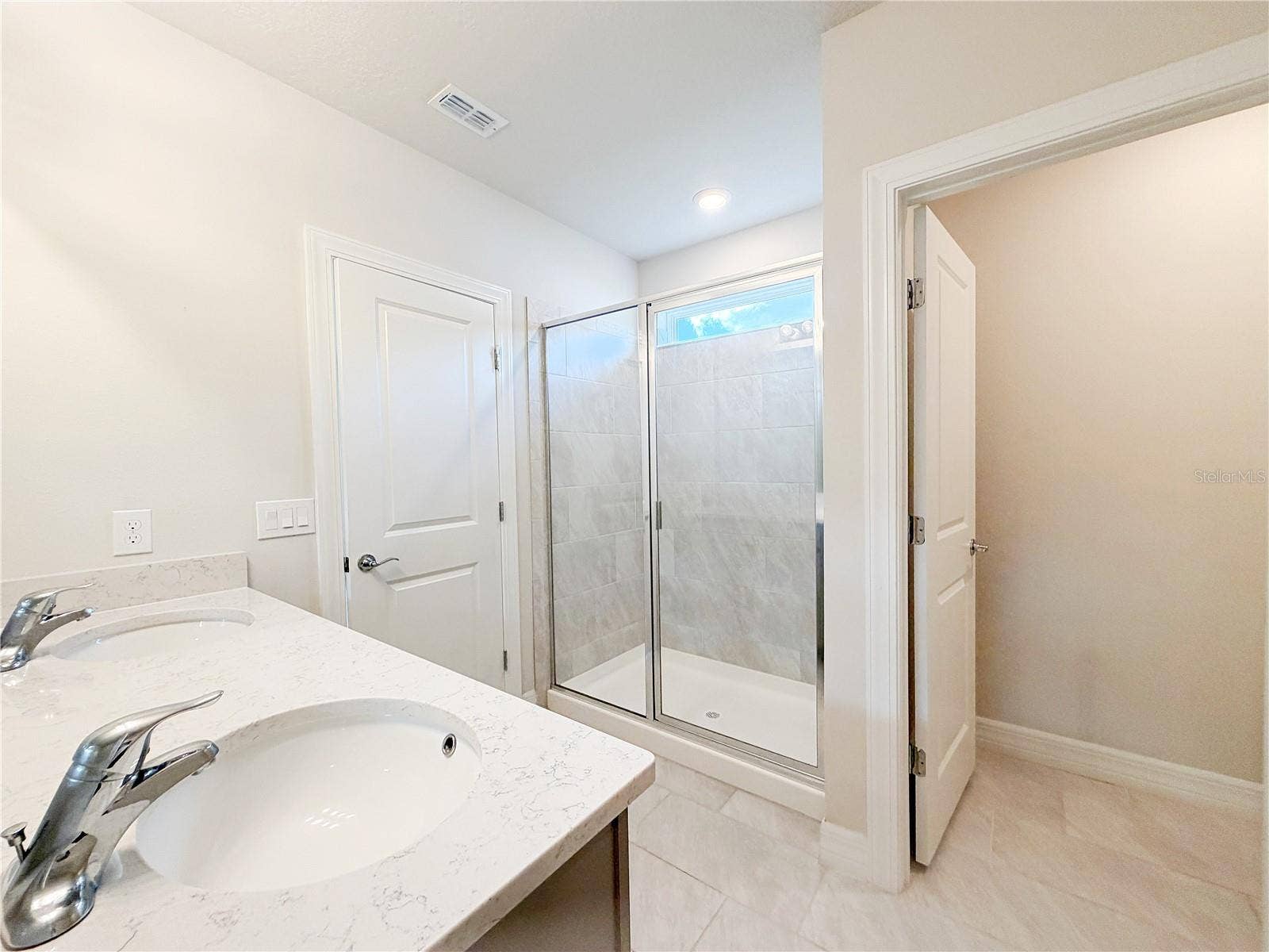 1079 MICHELANGELO LANE, Winter Haven, FL 33884 Master bathroom offers a water closet and walk in shower