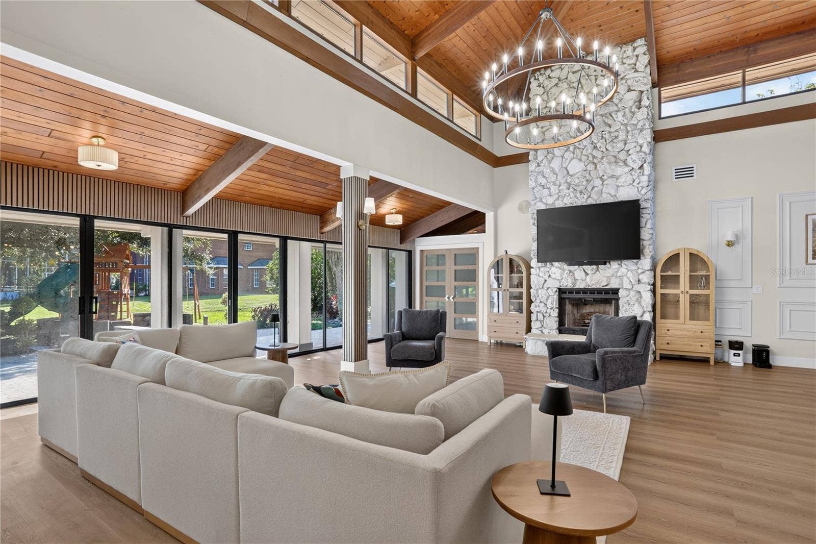 2313 INDIAN MOUND TRAIL, Kissimmee, FL 34746 Living room with stoned fireplace